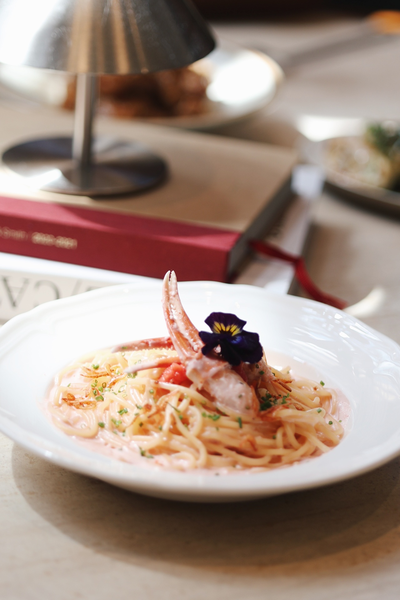 Crab pasta with edible flower