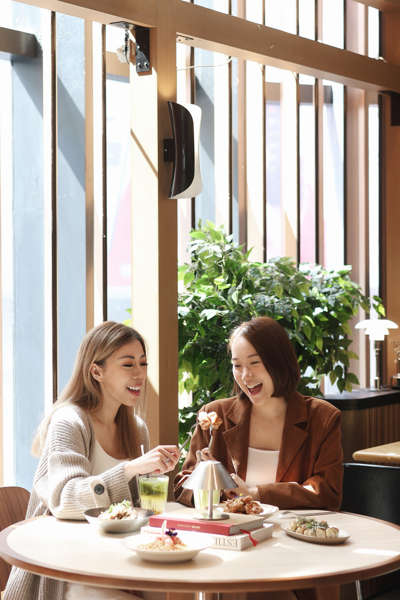 Friends sharing brunch by the window